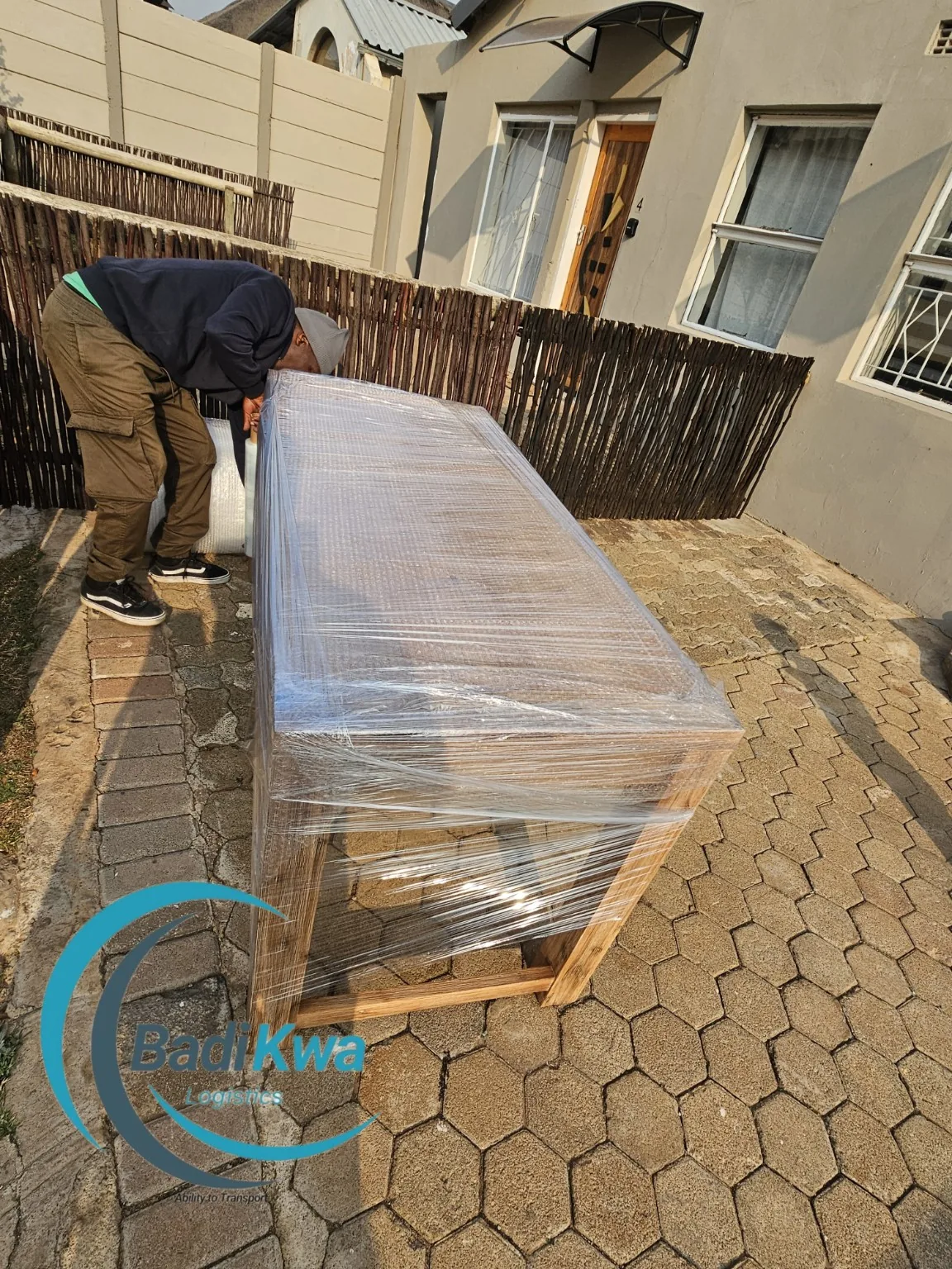 Furniture being wrapped for protection before transport