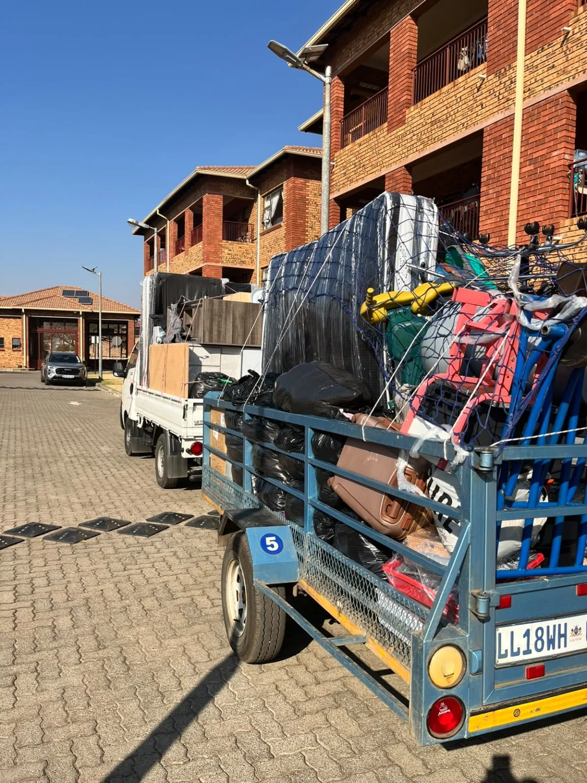 Loaded trailer and truck prepared for a household move
