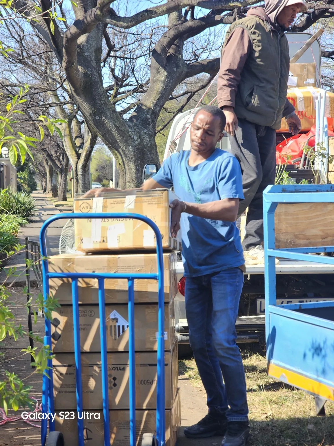 Team loading boxes onto a delivery truck